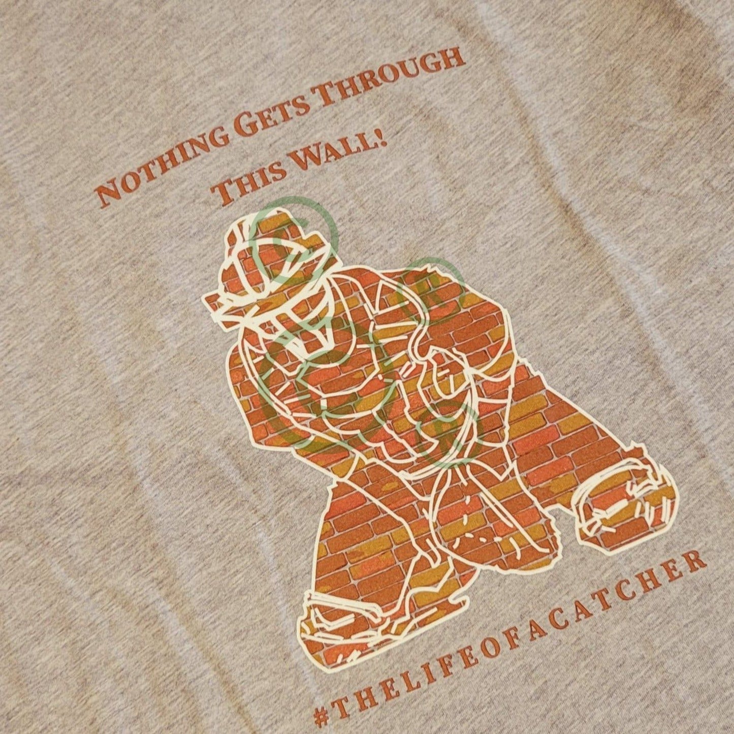 The-Catching-Guy-Tee-Catcher-wall-orange